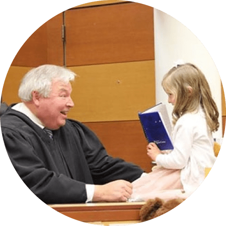 Judge at adoption hearing with child
